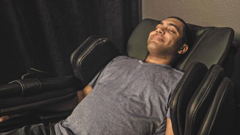 man in zero gravity massage chair