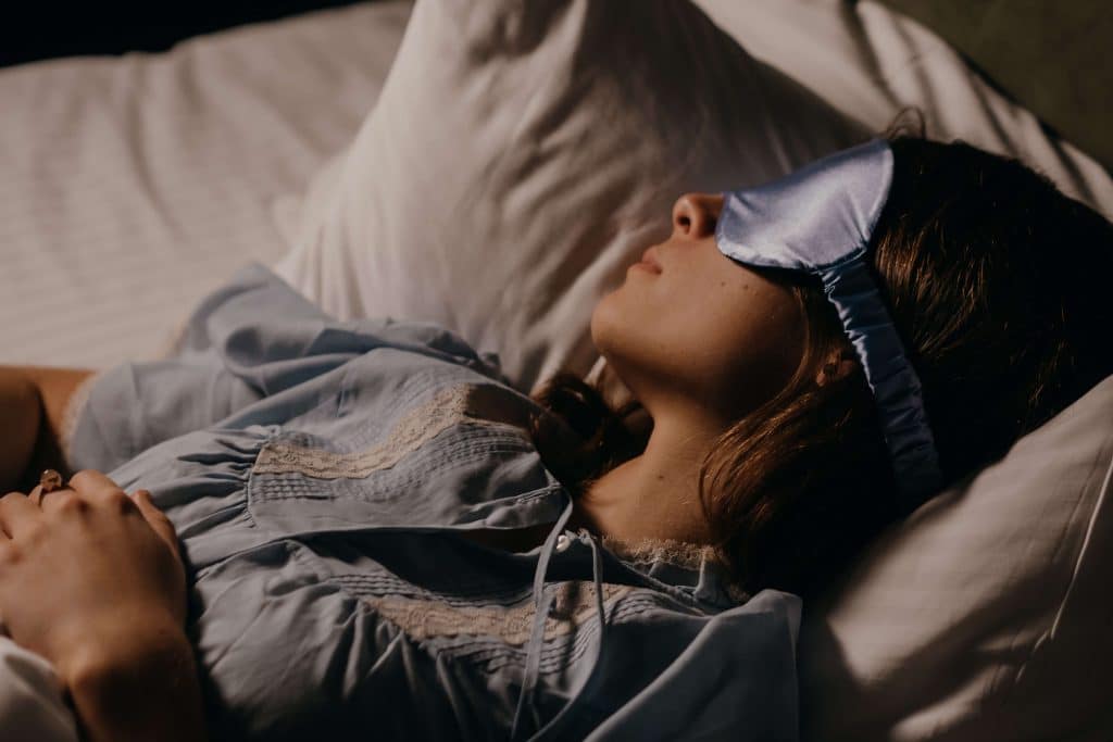 woman sleeping with an eye mask on