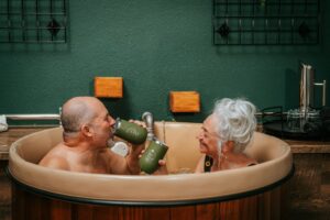 couple enjoying beer bath hydrotherapy at Oakwell Beer Spa