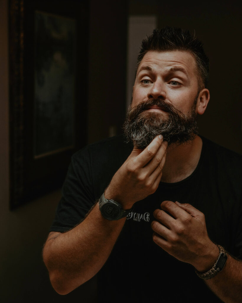 Man applying the best beard oil