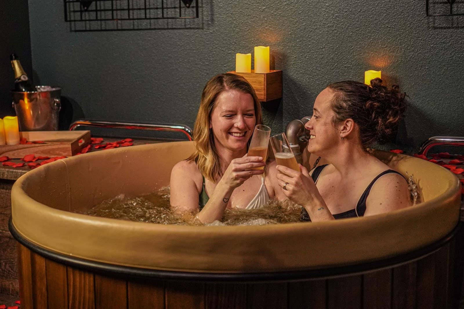 two women taking beer bath at Oakwell Beer Spa in Denver