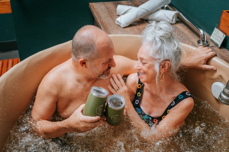 couple in a bubbly beer bath in Denver at Oakwell Beer Spa