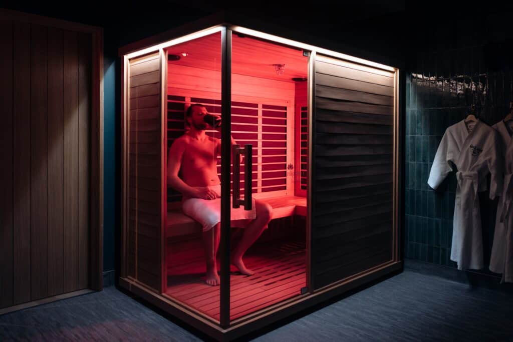 Man sitting in Infrared Sauna at Oakwell Beer Spa in Denver
