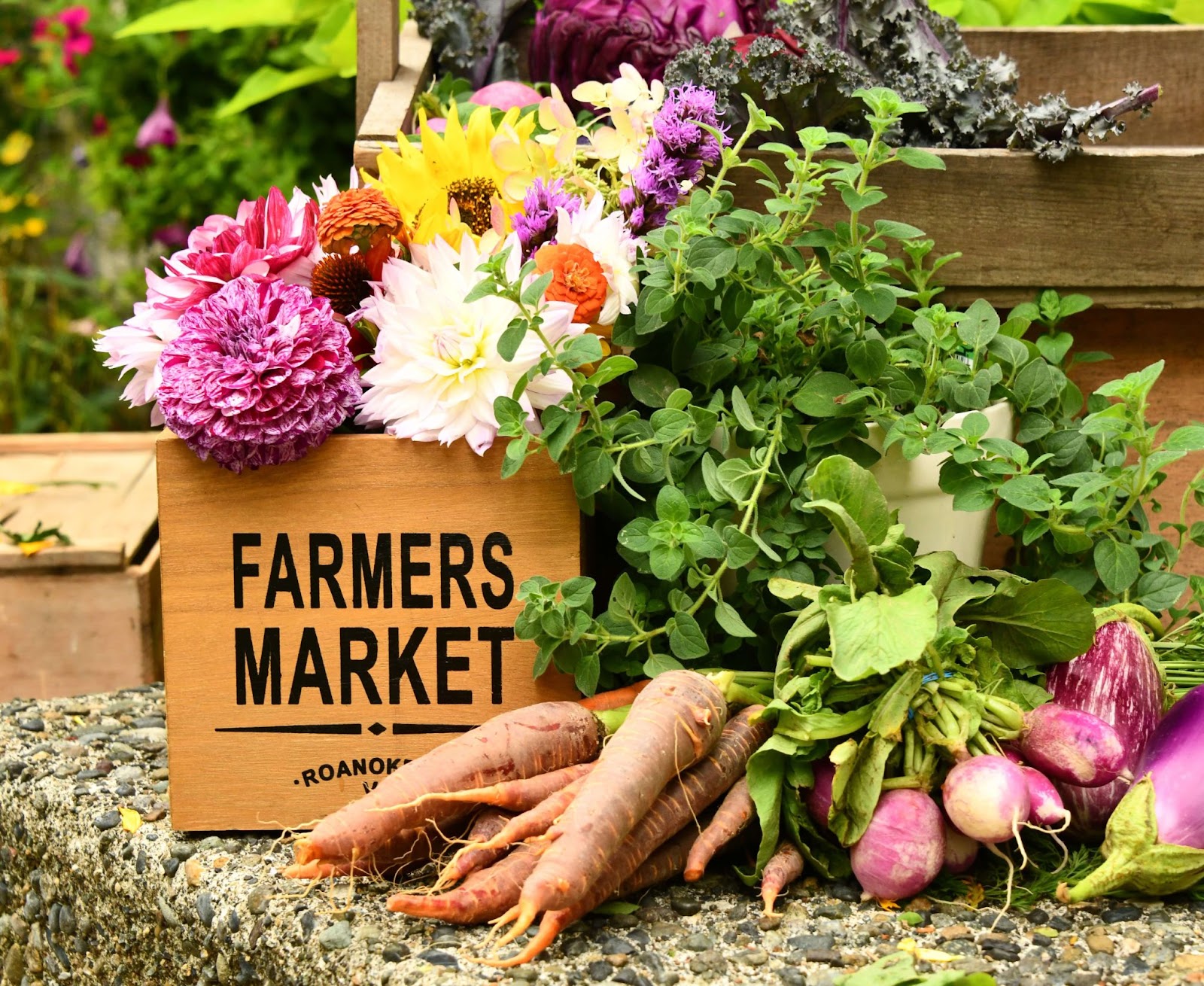 flowers in a box that says farmers market