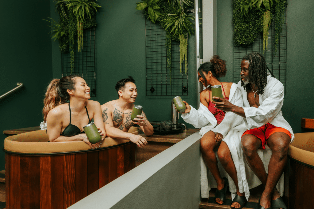 Two couples enjoy an herbal beer bath soak while sampling Oakwell’s drinks