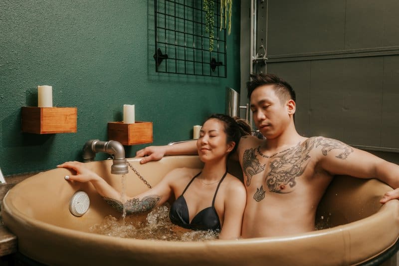Couple relaxing in a beer bath at Oakwell Beer Spa