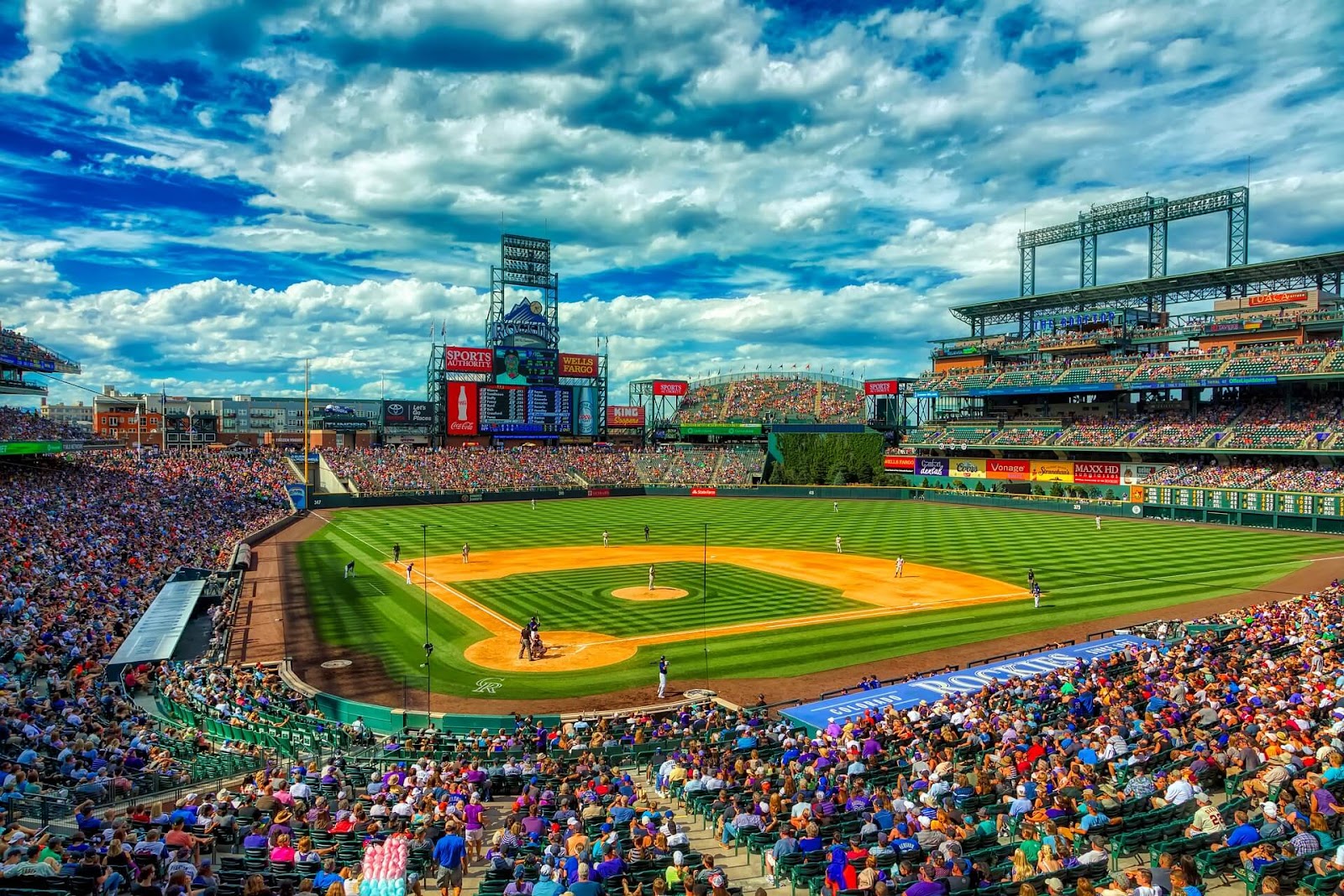 Colorado Rockies playing baseball at Coors Field during summer in Denver