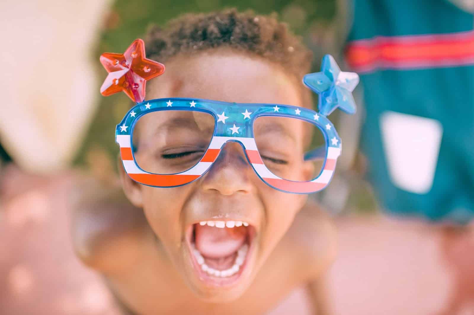 child with 4th of July glasses on