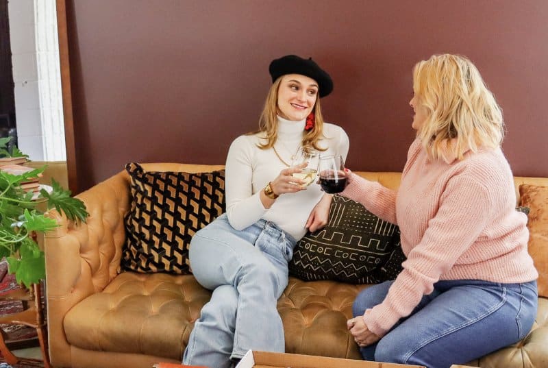 Two women with wine at the Infinite Monkey Theorem in Denver