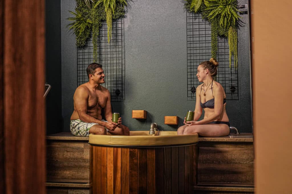 Couple relaxing in a beer bath at Oakwell Beer Spa