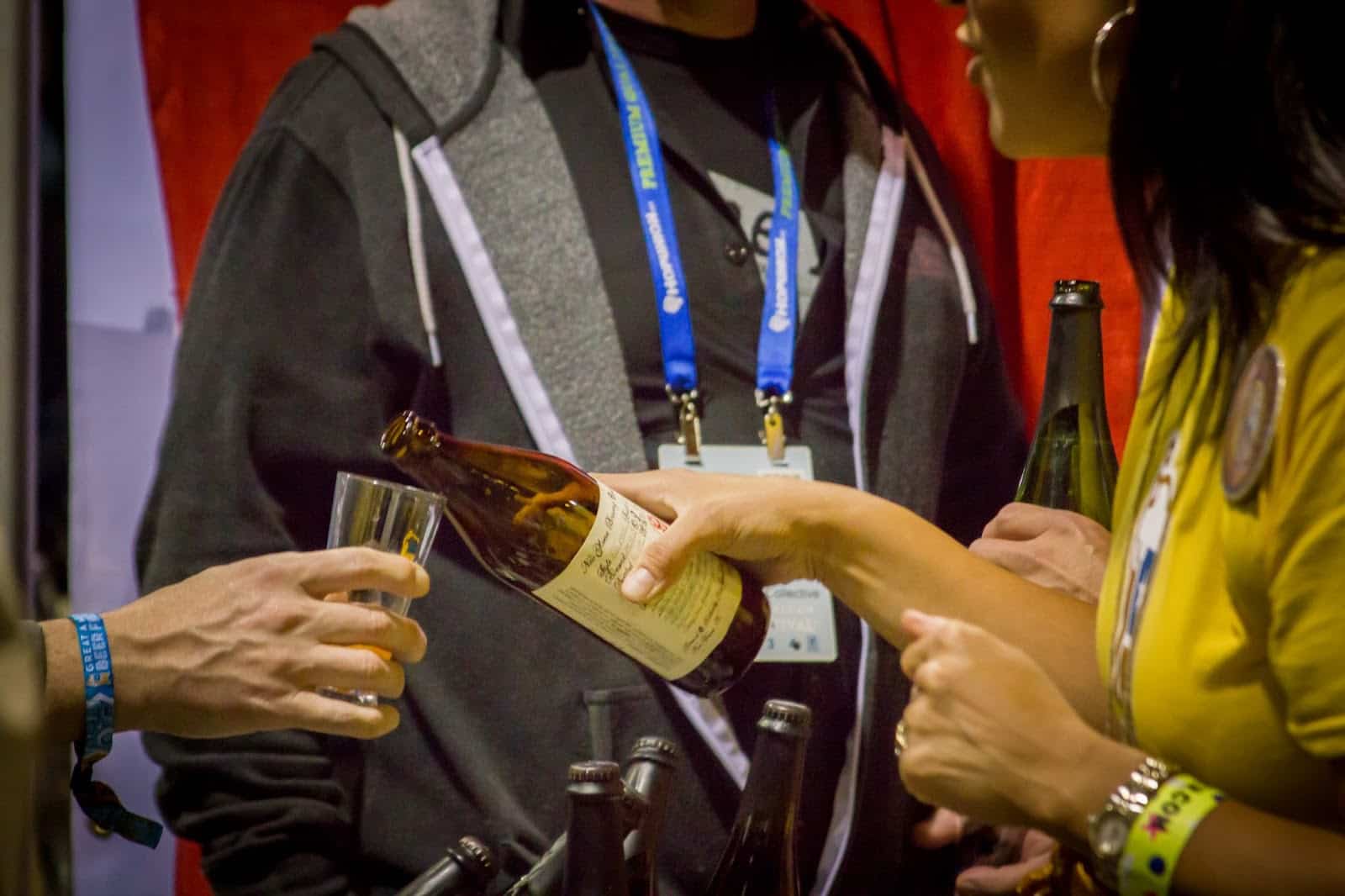 Person pouring beer at Great American Beer Festival in Denver