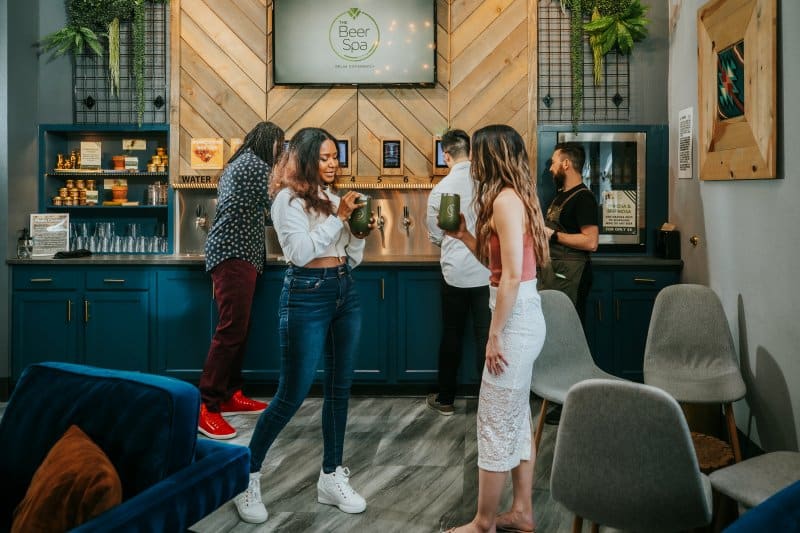 People in the taproom at Oakwell Beer Spa in Denver