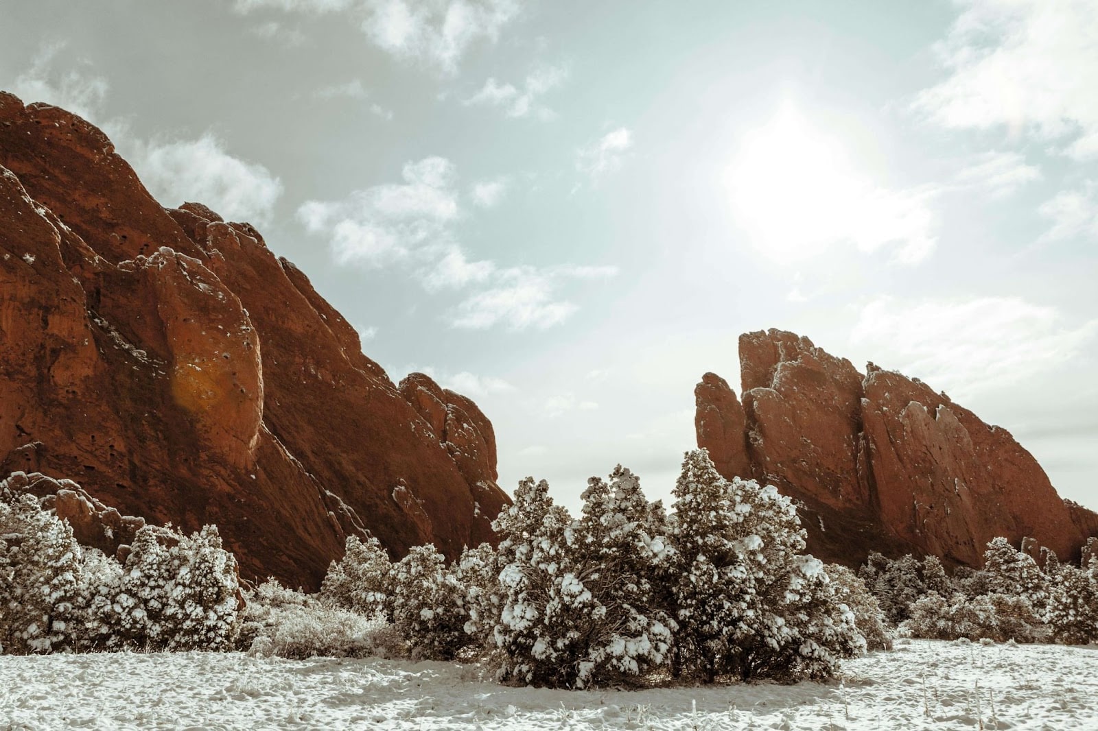 Red rocks formations surrounded by snow in Colorado