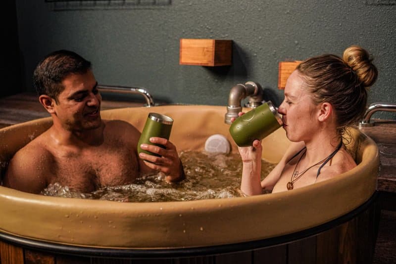 couple taking a beer bath at Oakwell Beer Spa for Denver staycation