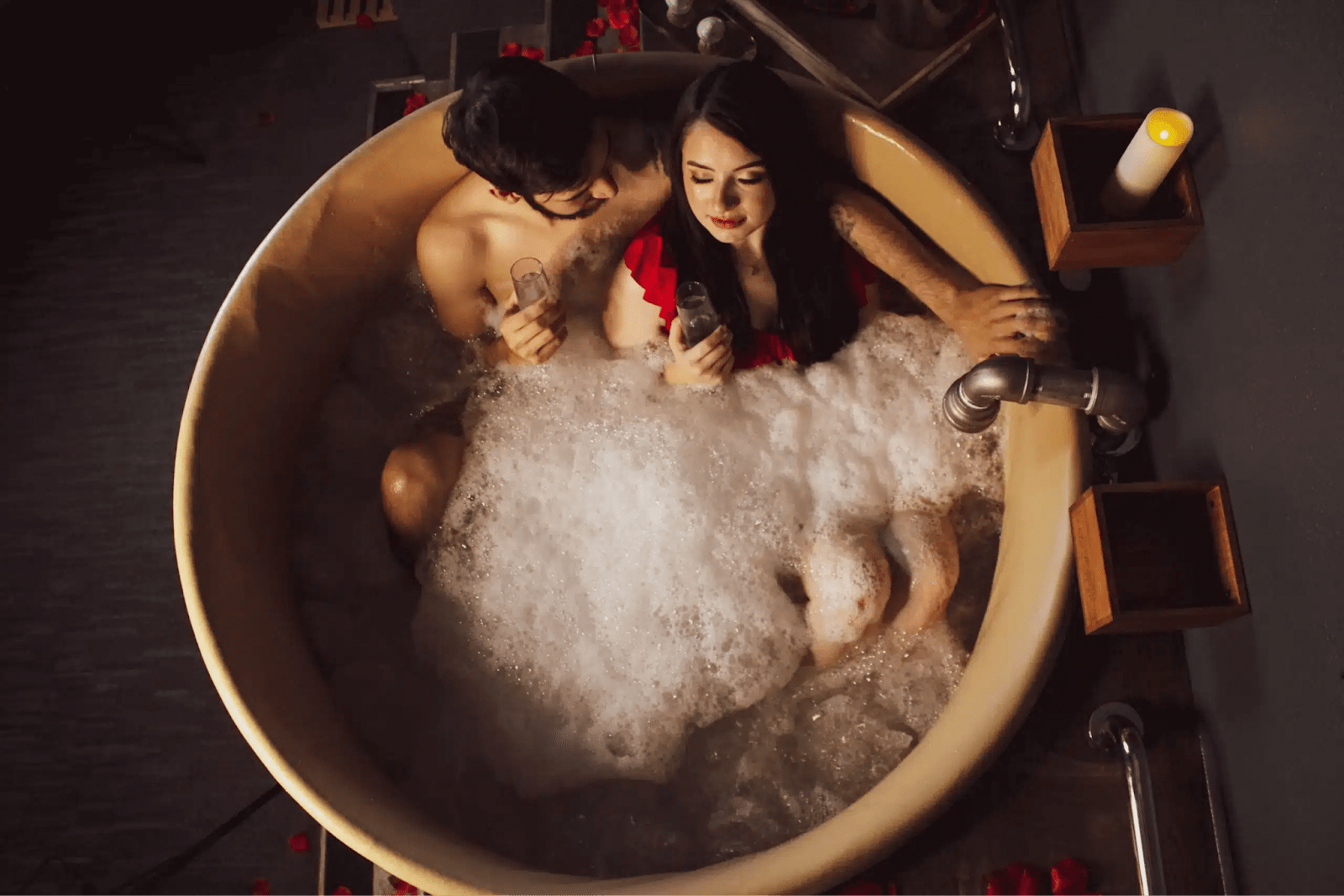 Couple relaxing in beer bath tub at Oakwell Beer Spa for Velentine's Day in Denver