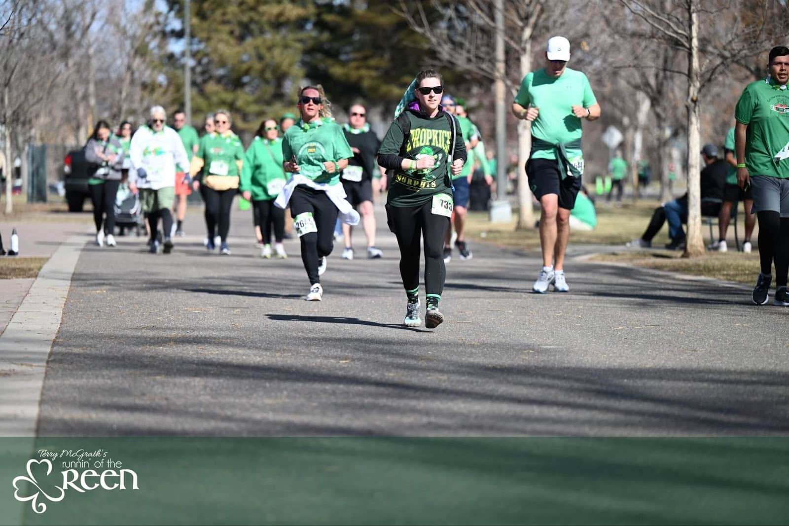 People running at Washington Park for Runnin' of the Green St. Patrick's Day race in Denver