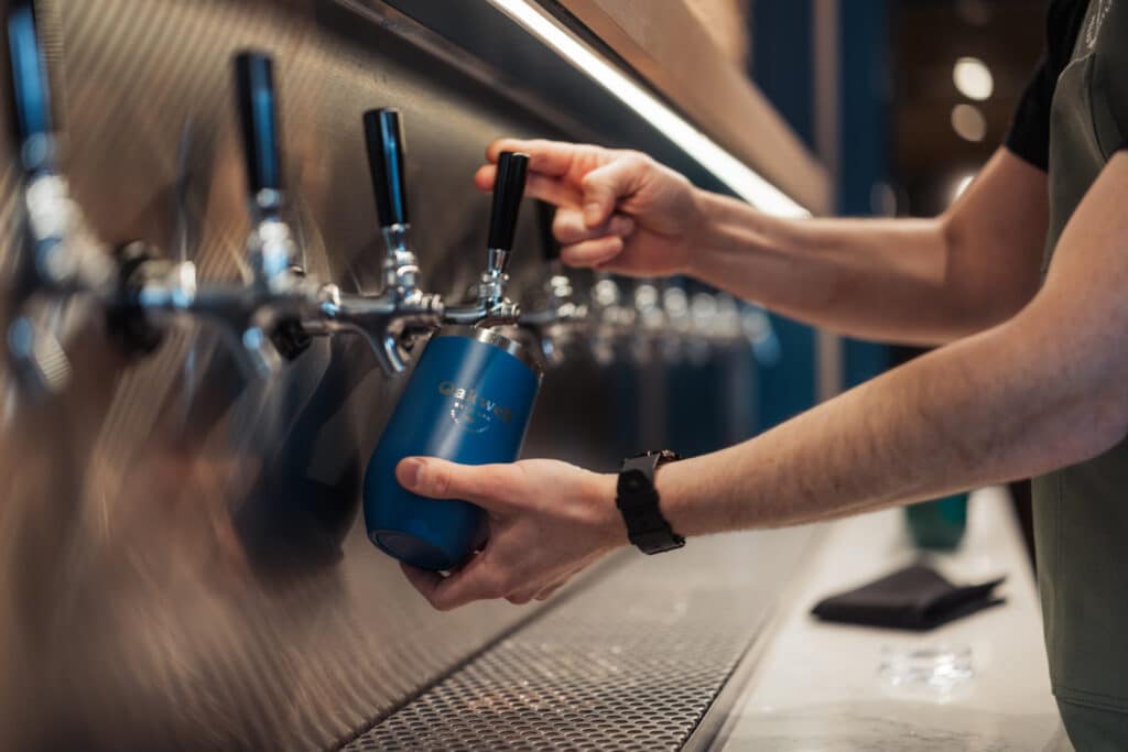 Pouring beer at Oakwell Beer Spa's self-service taproom
