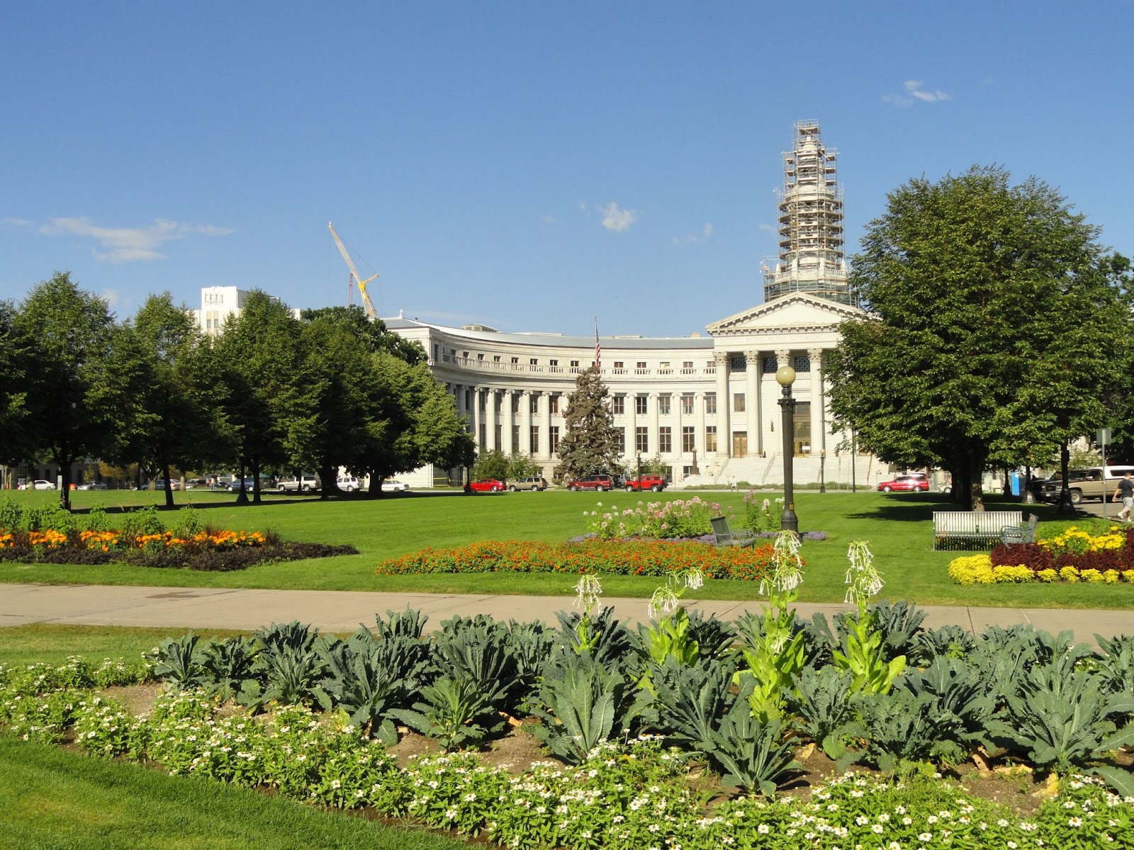 Colorado State Capitol at Civic Center Park with greenery and flowers in front