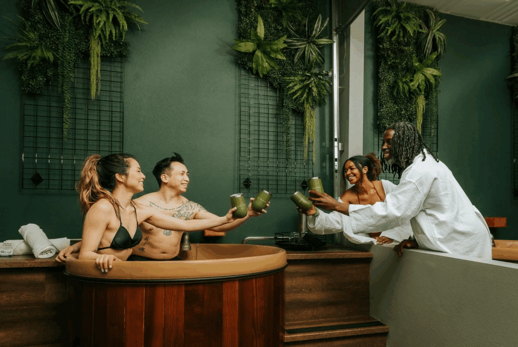 4 people taking a beer bath at Oakwell Beer Spa in Denver