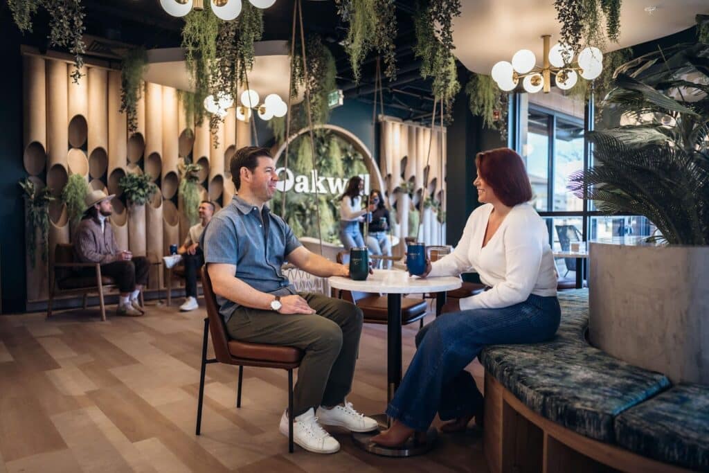Man and woman having a drink at Oakwell Beer Spa taproom