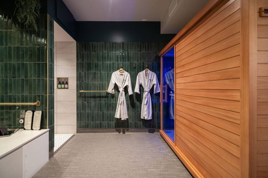 Spa room at Oakwell Beer Spa with robes, beer bath, shower, and sauna