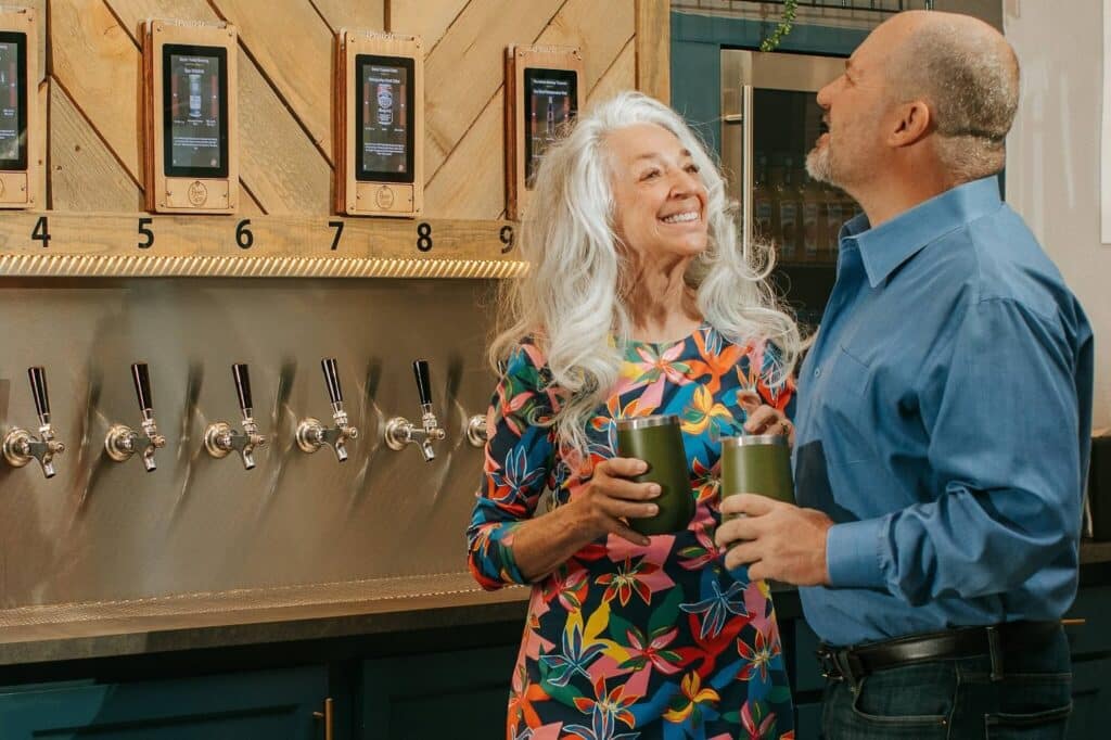 Couple drinking beer at Oakwell Beer Spa in Denver