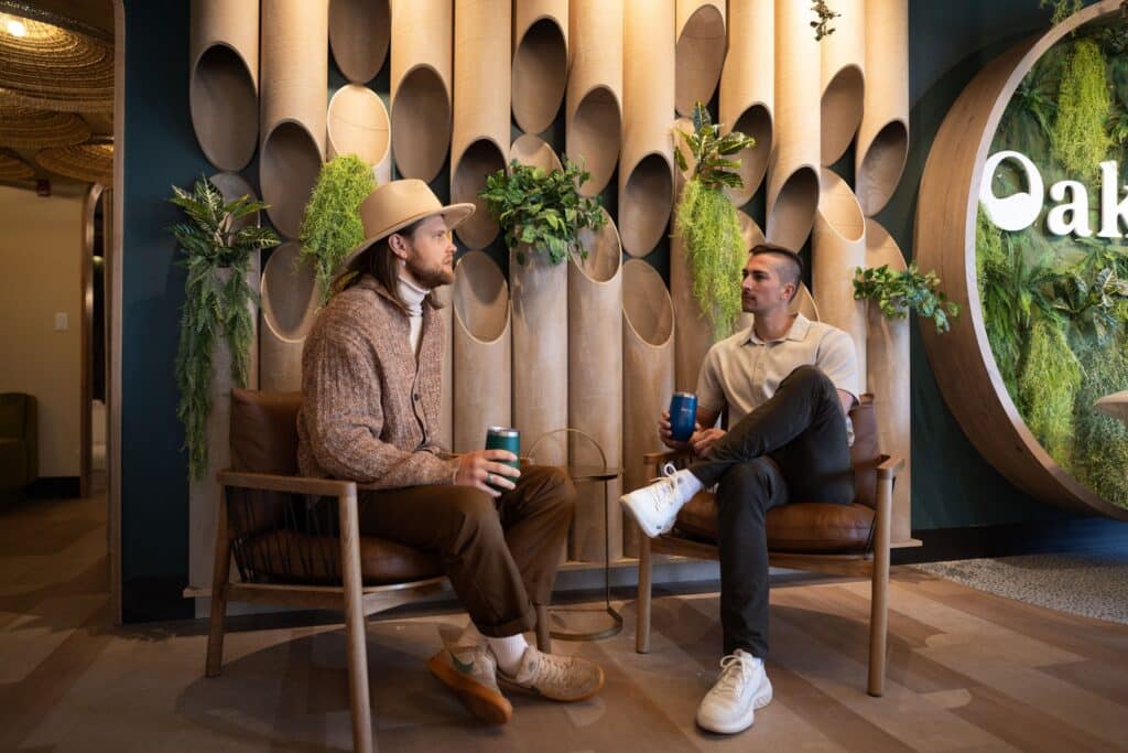 Two men enjoy drinks in the Oakwell taproom before their beer spa appointment