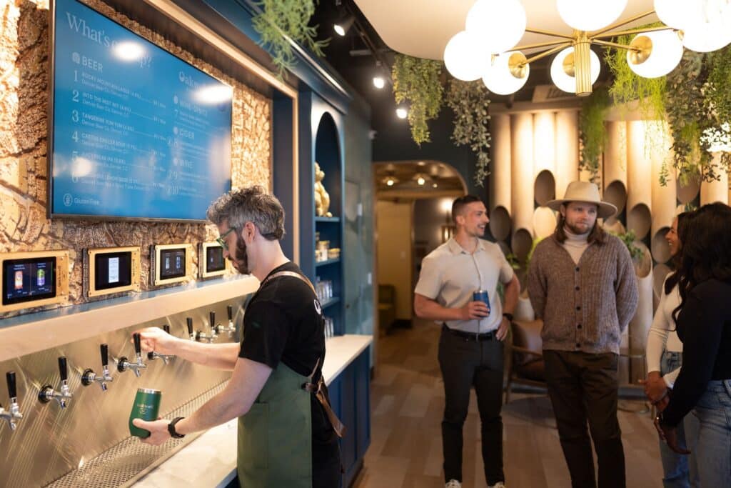 Two men craft beer from the Highlands Ranch taproom