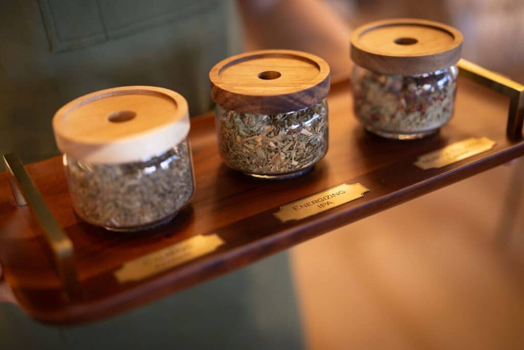 A selection of Oakwell’s herbal infusions in labeled glass jars